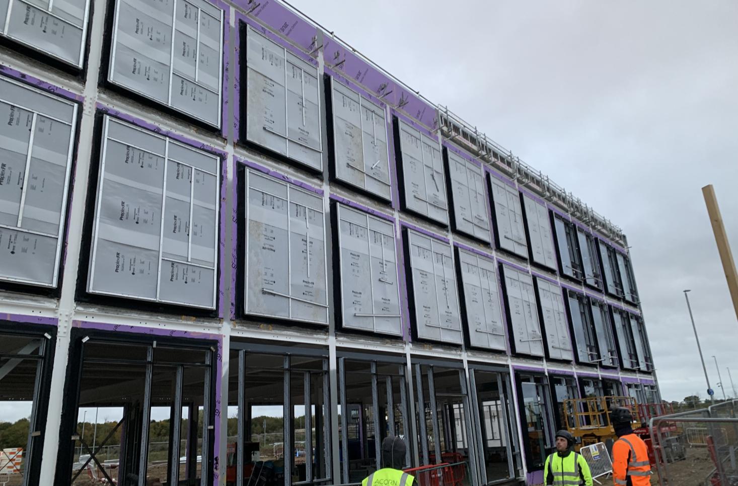 Facade panels being installed