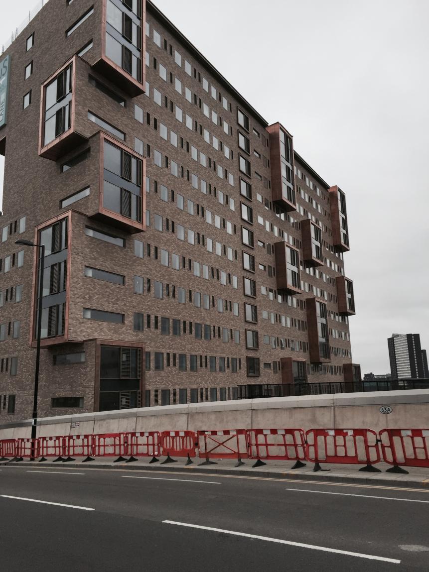 Student Accommodation Stratford — Brickwork-effect envelope, balconies and window installation.